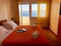 Апартаменты Paradiso with gorgeous sea view: A1 Doris (4+2), SA2 Petra (2+2), SA3 Nina (2) Локва Рогозница - Ривьера Омиш  - Апартамент - A1 Doris (4+2): спальная комната