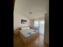 Апартаменты Draga - comfortable & afordable: A1(2+2), A2(6), A3(2+2) Вир - Задар Ривьера  - Апартамент - A1(2+2): спальная комната