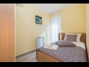 Апартаменты Kostrena - with pool: A1(5), A2(5) Kострена - Kvarner  - Апартамент - A2(5): спальная комната