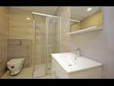 Апартаменты Luxury - heated pool, sauna and gym: A1(2), A2(2), A3(4), A4(2), A5(4), A6(2) Макарска - Ривьера Макарска  - ванная комната с туалетом