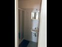 Апартаменты Zorica - with view: A1(4+1), SA2(2+1), SA3(2+1), SA4(2+1), A5(10+1) Марушичи - Ривьера Омиш  - Студия- апартамент - SA4(2+1): ванная комната с туалетом