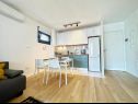 Апартаменты Mendula - private garage: A1(2+2), A2(2+2) Сплит - Ривьера Сплит  - Апартамент - A1(2+2): кухня и столовая